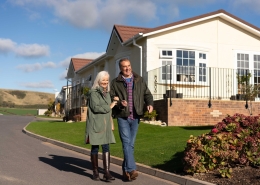 couple walking in residential park home development