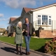 couple walking in residential park home development