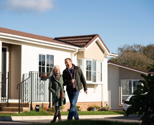 couple walking in park home development
