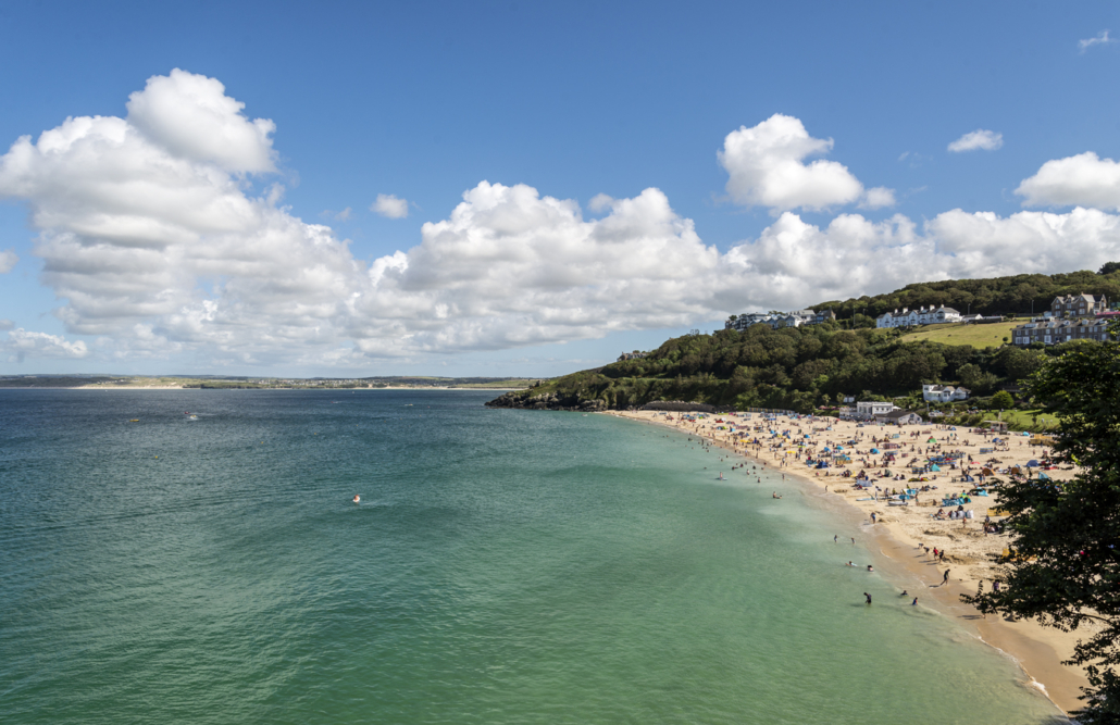 blue sea and sandy St Ives beach in Cornwall